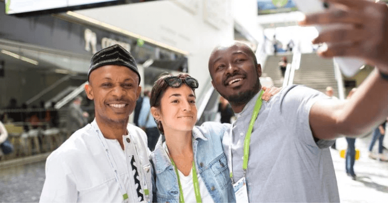 Three young people taking a selfie in an urban environment