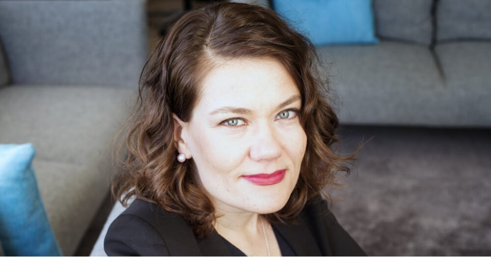 Pauliina Pulkkinen smiling to the camera