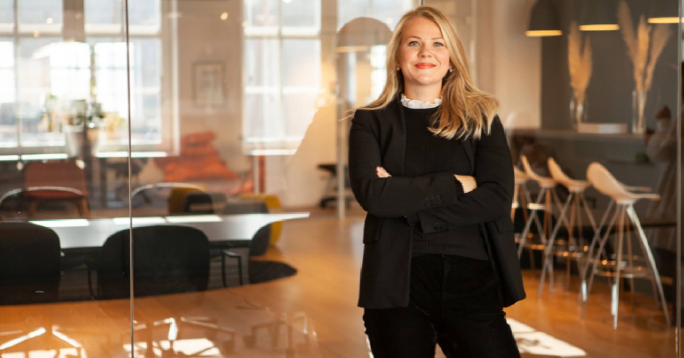 Guro Lindbjerg smiling to the camera in an office environment