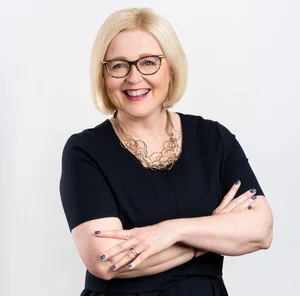 Tytti Sulander smiling to the camera